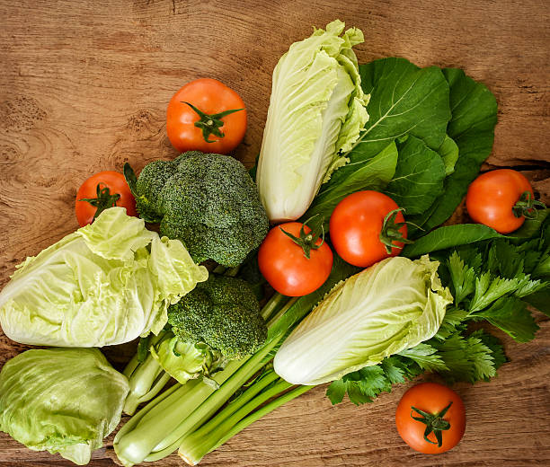 istock Mixed organic vegetables on wood background. 627305168