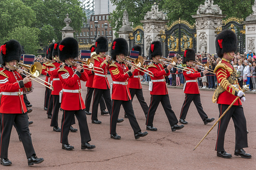 London, England - June 17 2016: British Royal guards perform the Changing of the Guard in Buckingham Palace, London, England, Great Britain