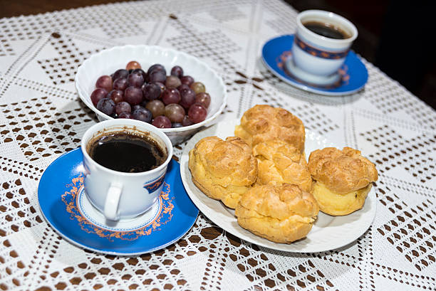 istock Coffee, cream puffs and grapes in a bowl 627305648