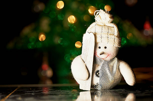 istock Christmas decor. Snowman with skis felt, close 627306756