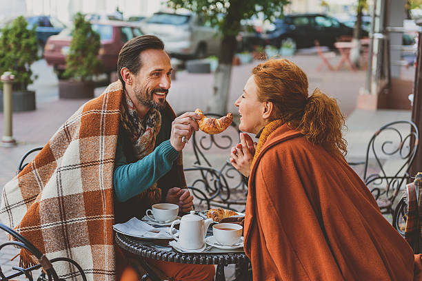 istock Joyful loving couple dating in cafeteria 627307216