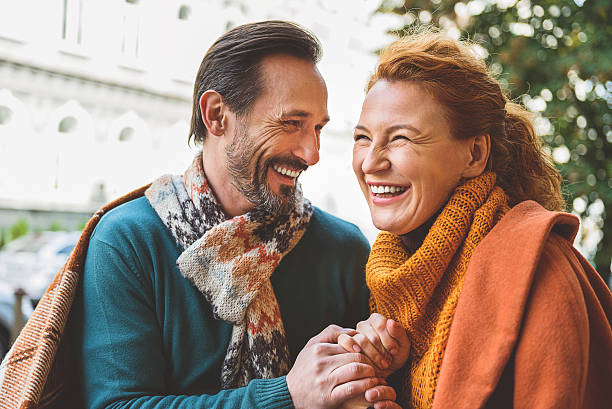 istock Senior lovers enjoying date outside 627312378