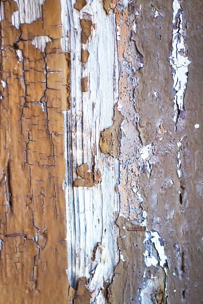 istock Textured Gray-Brown Background: Distressed Paint on Old Wood 627312446