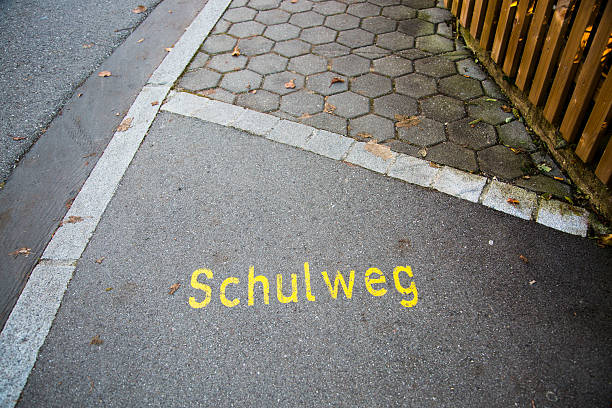 School way written on paving stone