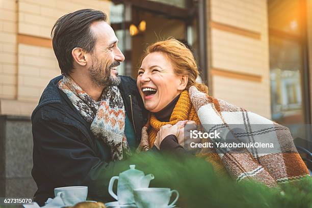 Man And Woman Dating In Cafe Stock Photo - Download Image Now - Mature Couple, Lifestyles, Happiness