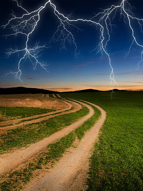 istock green field with storm dark clouds 627315624