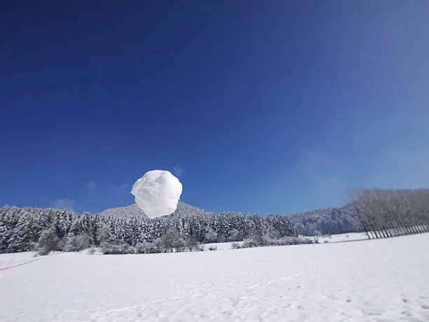 Photo of someone throwing snowball