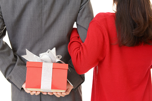 Happy couple with a red gift box