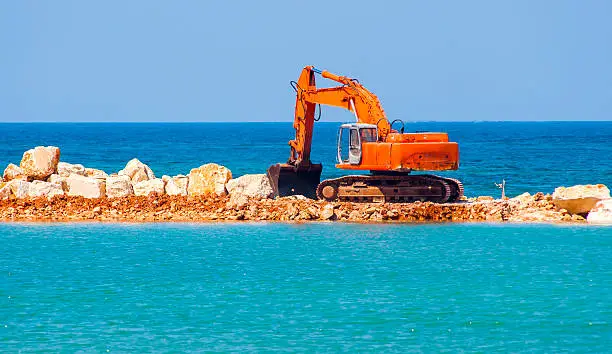 Photo of building the jetty with heavy excavator machine