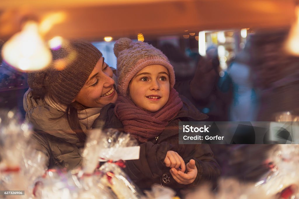 Merry Christmas- retro look Family at christmas market at winter time in December - vintage look Christmas Market Stock Photo