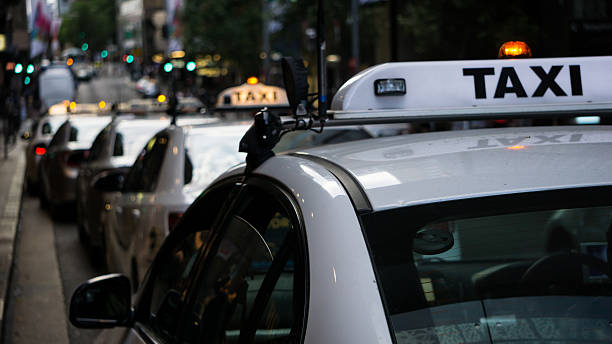 Taxi in Sydney Taxis, cars, light, bokeh  taxi photos stock pictures, royalty-free photos & images