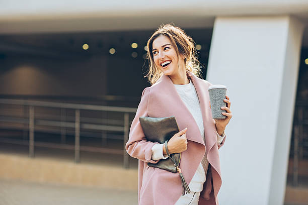 istock Elegant woman walking outdoors and looking back 627337220