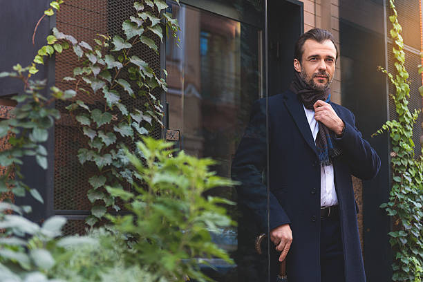 istock Confident man standing near door 627339798