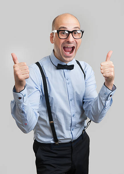 istock funny man wearing bow tie and suspenders 627341376