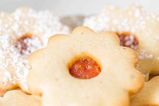 istock Homemade apricot jam Linzer with icing sugar close up 627344456
