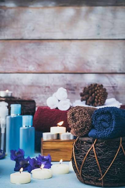 istock Rolled up white spa towels, selective focus, vintage 627349944