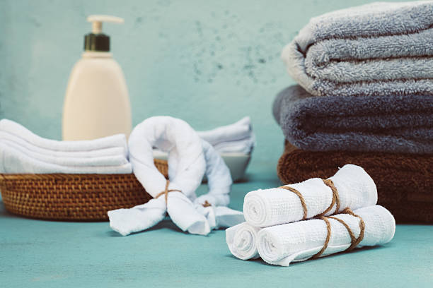 istock Rolled up white spa towels, selective focus, vintage 627349946