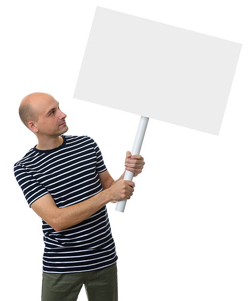 istock Casual young man holding a placard 627350938