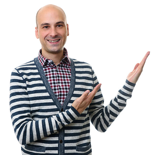 istock cheerful bald man pointing to copy space 627351166