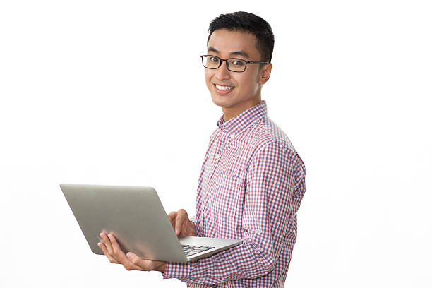 istock Smiling Asian businessman with laptop 627352548