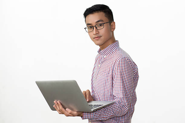 istock Smart young businessman holding portable computer 627352572