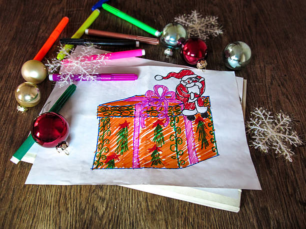 istock Child's drawing of Santa Claus with a gift 627355592