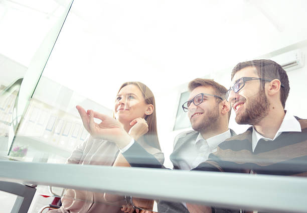 istock Coworkers working in sunny office. Successful businass team. Bot 627355614