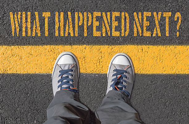 istock What happened next?,  print with sneakers on asphalt road. 627356312