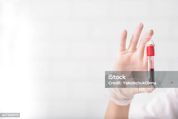 Scientist Analyzing Blood Test Tube Stock Photo - Download Image Now - Blood, Laboratory, Medical Test