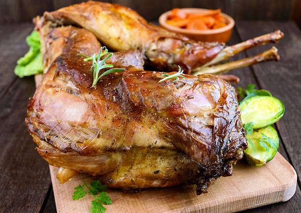 istock Roast whole rabbit on a wooden board 627365334