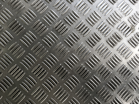 Metal plate floor tiles with anti slip texture.