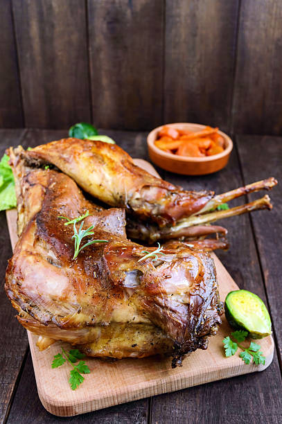 istock Roast whole rabbit on a wooden board 627365410