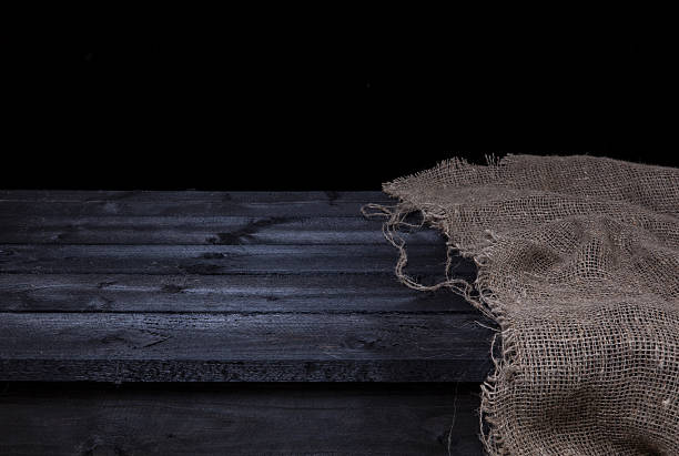 istock Dark wooden table for product display montage 627371510