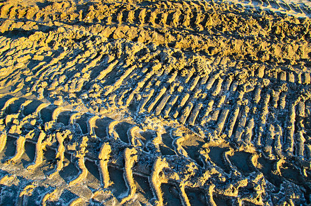 istock Wheel tracks on a sand in a quarry 627371764