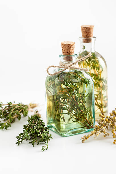 istock Thyme and rosemary essential oil or infusion and herbs 627372708
