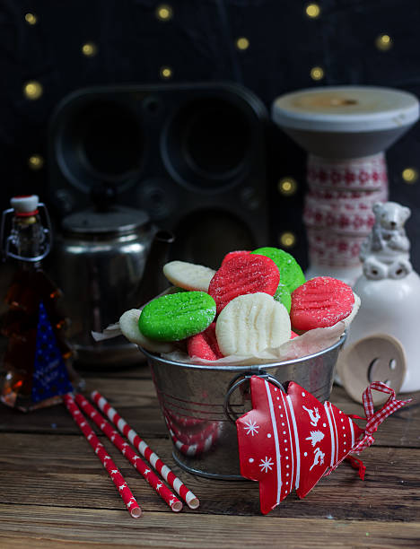 Christmas Peppermint Patties. Homemade christmas candy and christmas decoration on rustic wooden table. Selective focus.