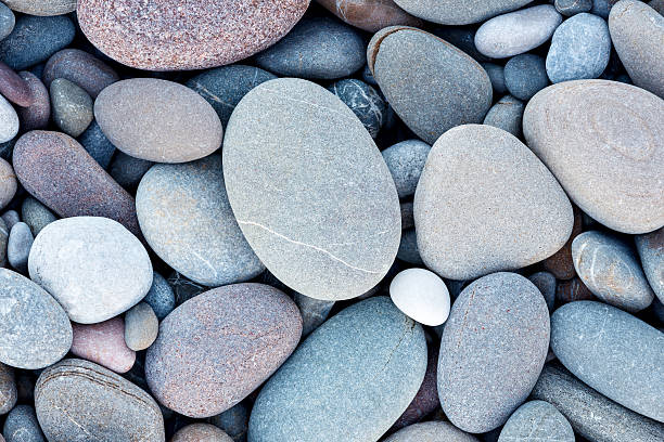 fondo abstracto de textura de mar de guijarros redondos lisos - piedra roca fotografías e imágenes de stock