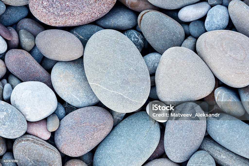 Abstract smooth round pebbles sea texture background Rock - Object Stock Photo