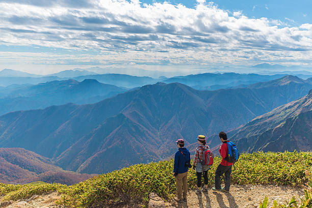 Mount Tanigawa Gunma , Japan - October 26, 2014: Men and woman with Trekking backpacks are walking on trail to the  top of Mount Tanigawa. gunma prefecture stock pictures, royalty-free photos & images