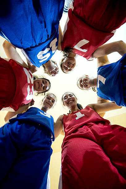 istock Multi-ethnic female high school basketball team during a huddle 627374026