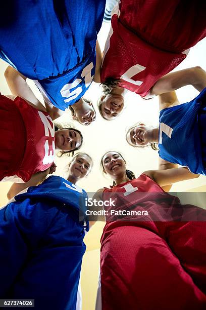 Multiethnic Female High School Basketball Team During A Huddle Stock Photo - Download Image Now