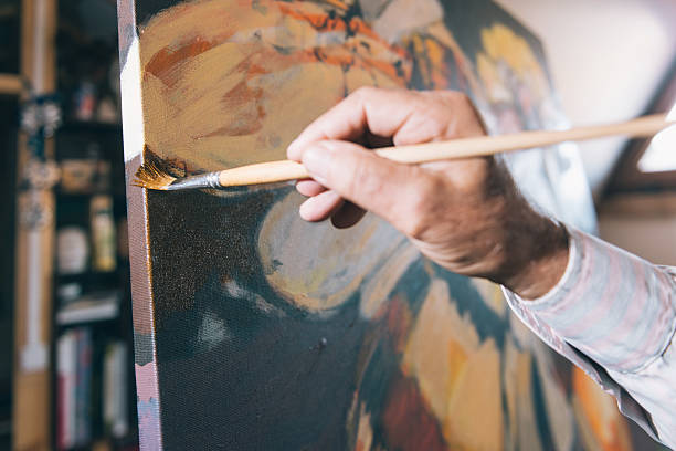 istock Artist painting in his workshop 627379704