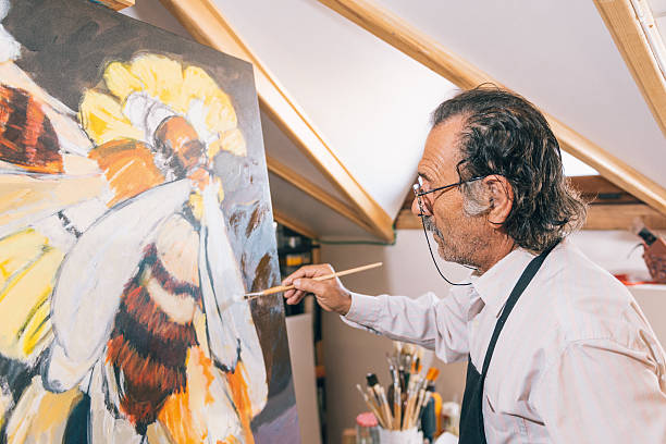 istock Artist painting in his workshop 627380200