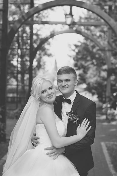 istock The groom gently hug the bride's shoulders 627380666