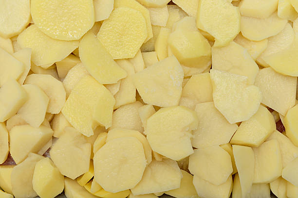 istock sliced potatoes ready for baking or frying 627389994