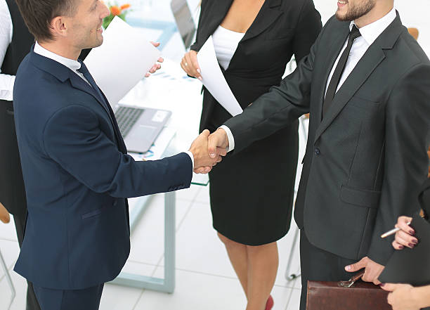 istock Diversity business team concluding contract with handshake in an 627390382
