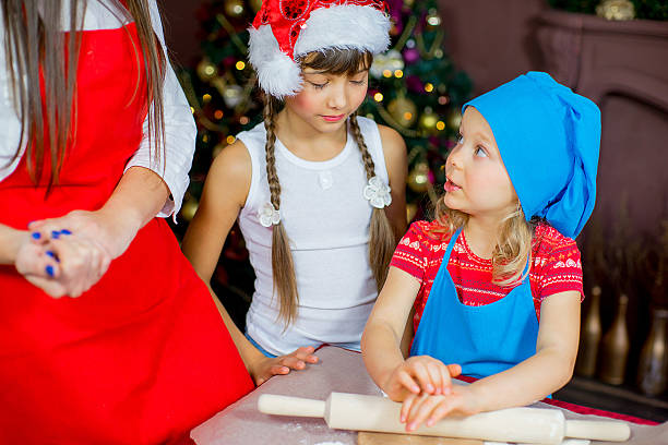 istock children baking christmas cookies 627391366