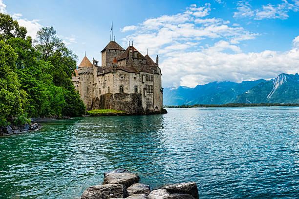Chateau de Chillon on the shore of Lake Geneva,Switzerland Montreux, Switzerland - June 25, 2013: Chateau de Chillon (Chillon Castle) on the shore of Geneva Lake.  The chateau is the most popular castle in Switzerland. chateau de chillon stock pictures, royalty-free photos & images