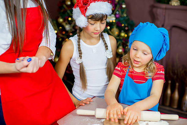istock children baking christmas cookies 627396680