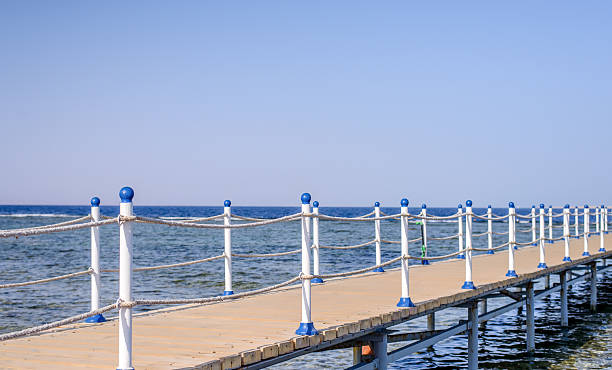 istock Wooden pier at a tropical resort 627399158